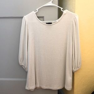 A white sweater-like top.